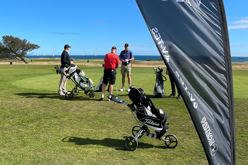 golfers preparing to play in a golf course near the coast